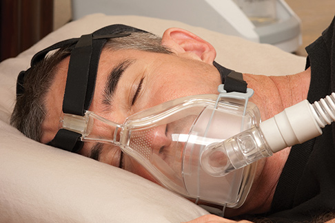 Man wearing CPAP orofacial mask