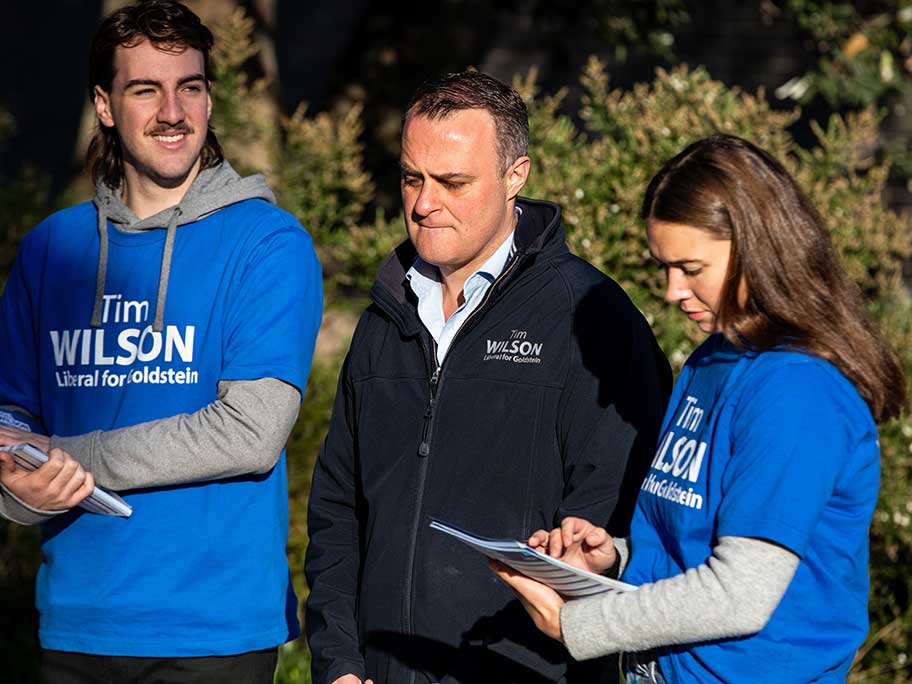 Liberal candidate Tim Wilson (centre) campaigns for the seat of Goldstein, Melbourne, Saturday, 21 May 2022