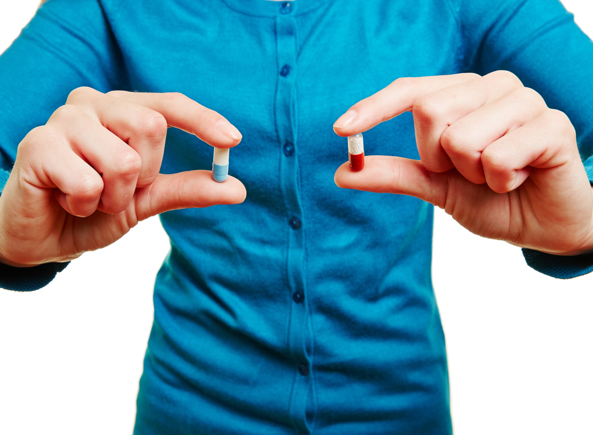 Man holding two pills