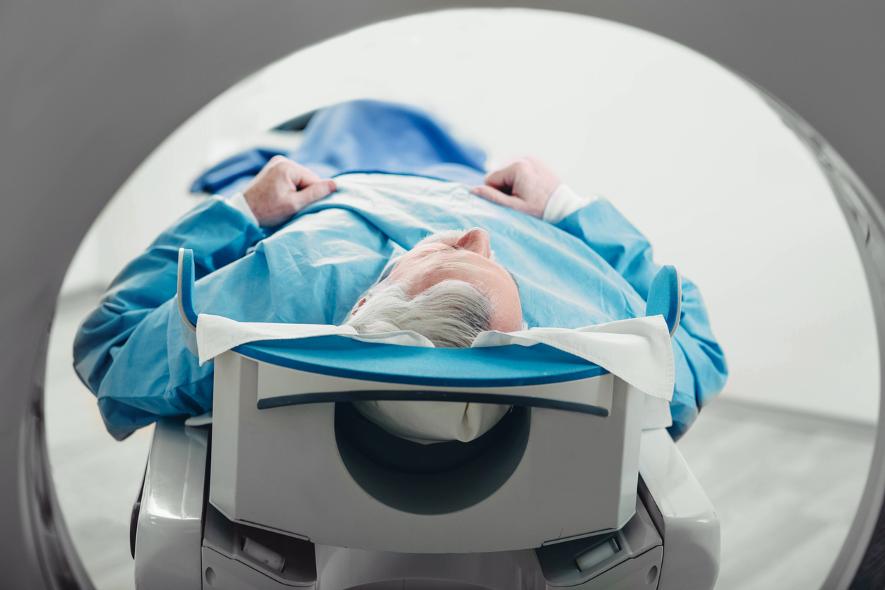 senior man entering a CT scanner