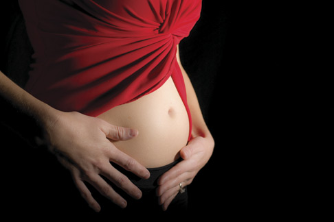 Woman's abdomen in early pregnancy
