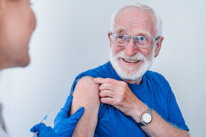 elderly man having coronavirus vax
