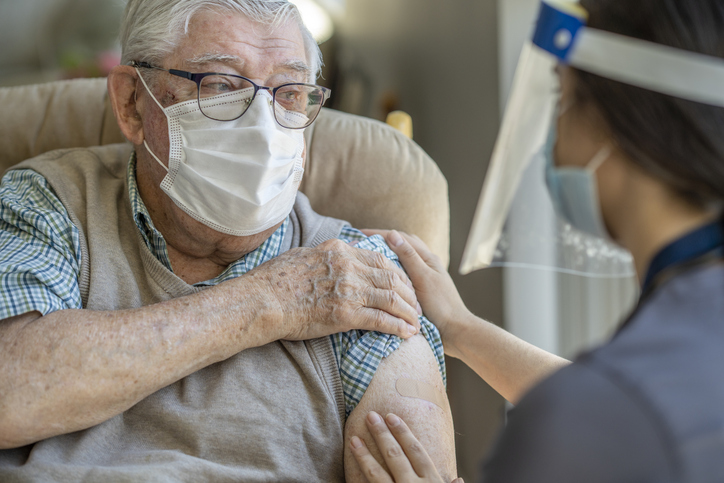 Elderly person receiving vaccine