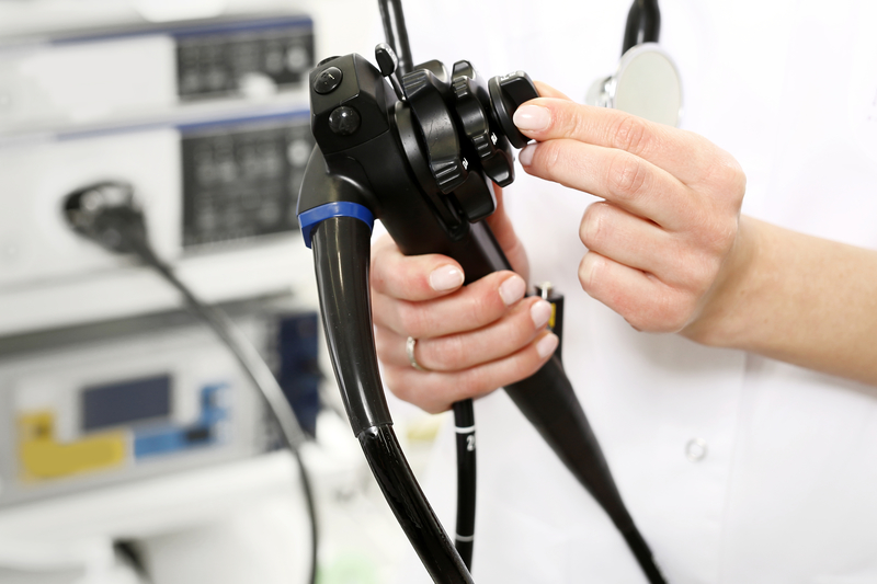 Doctor holding endoscope