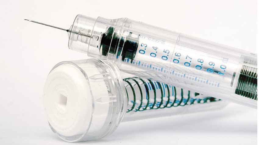 vial of heparin and syringe