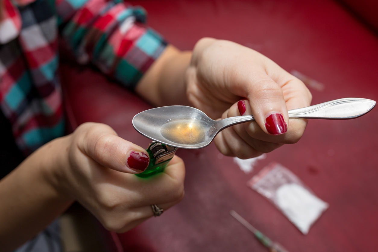 Preparing to inject heroin