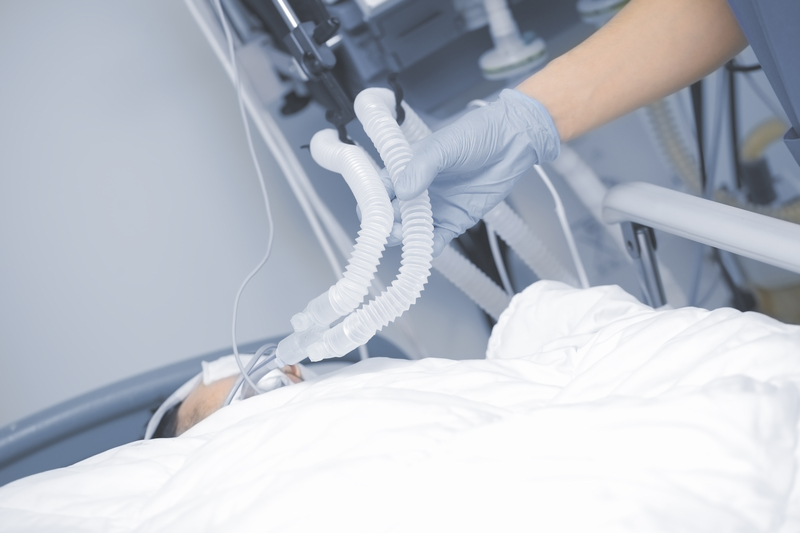Person in ICU on ventilator