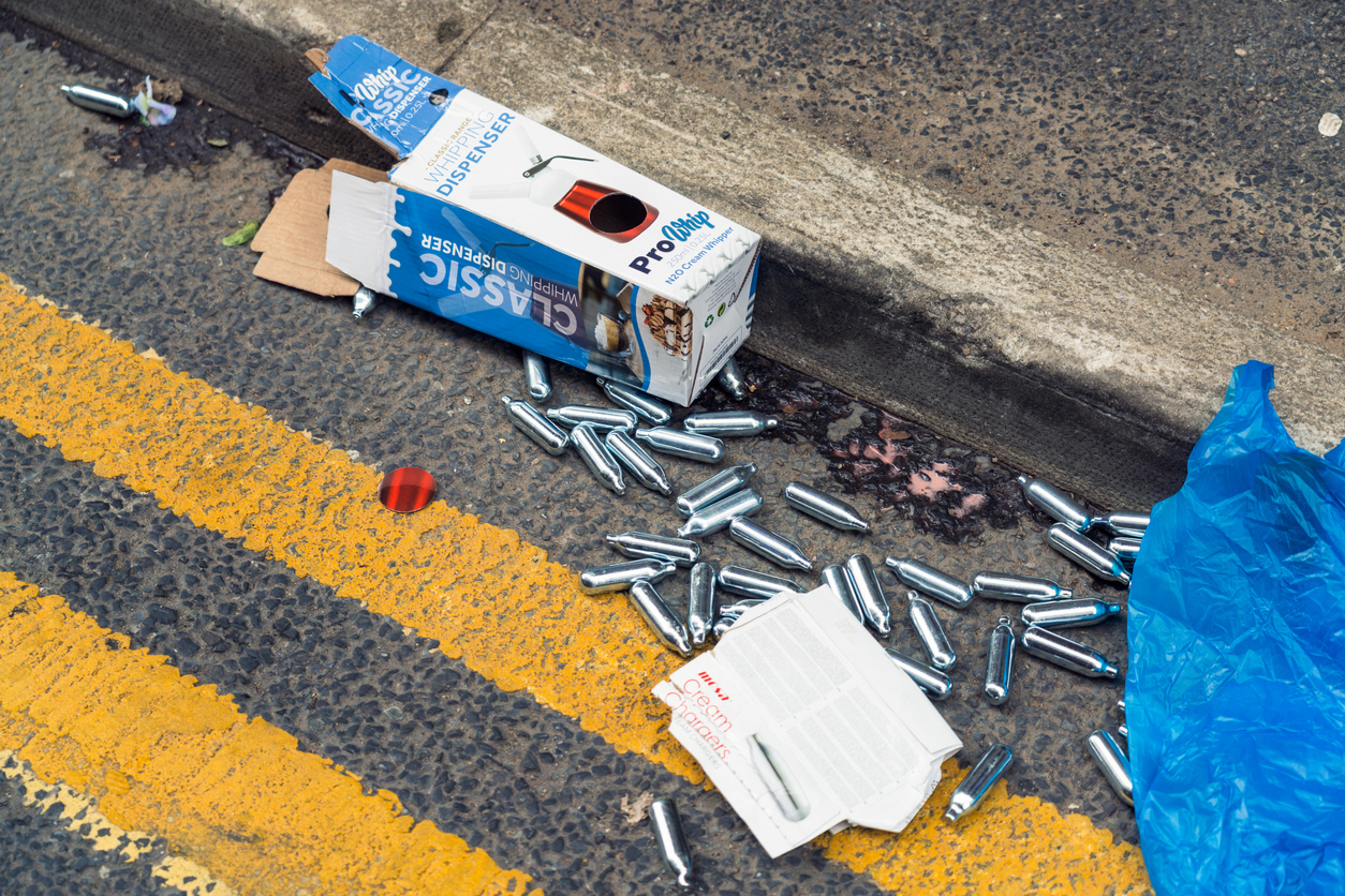 Nitrous oxide cannisters nangs discarded on the street