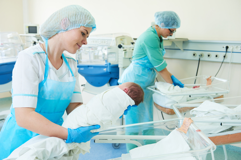 nurses and babies in neonatal unit