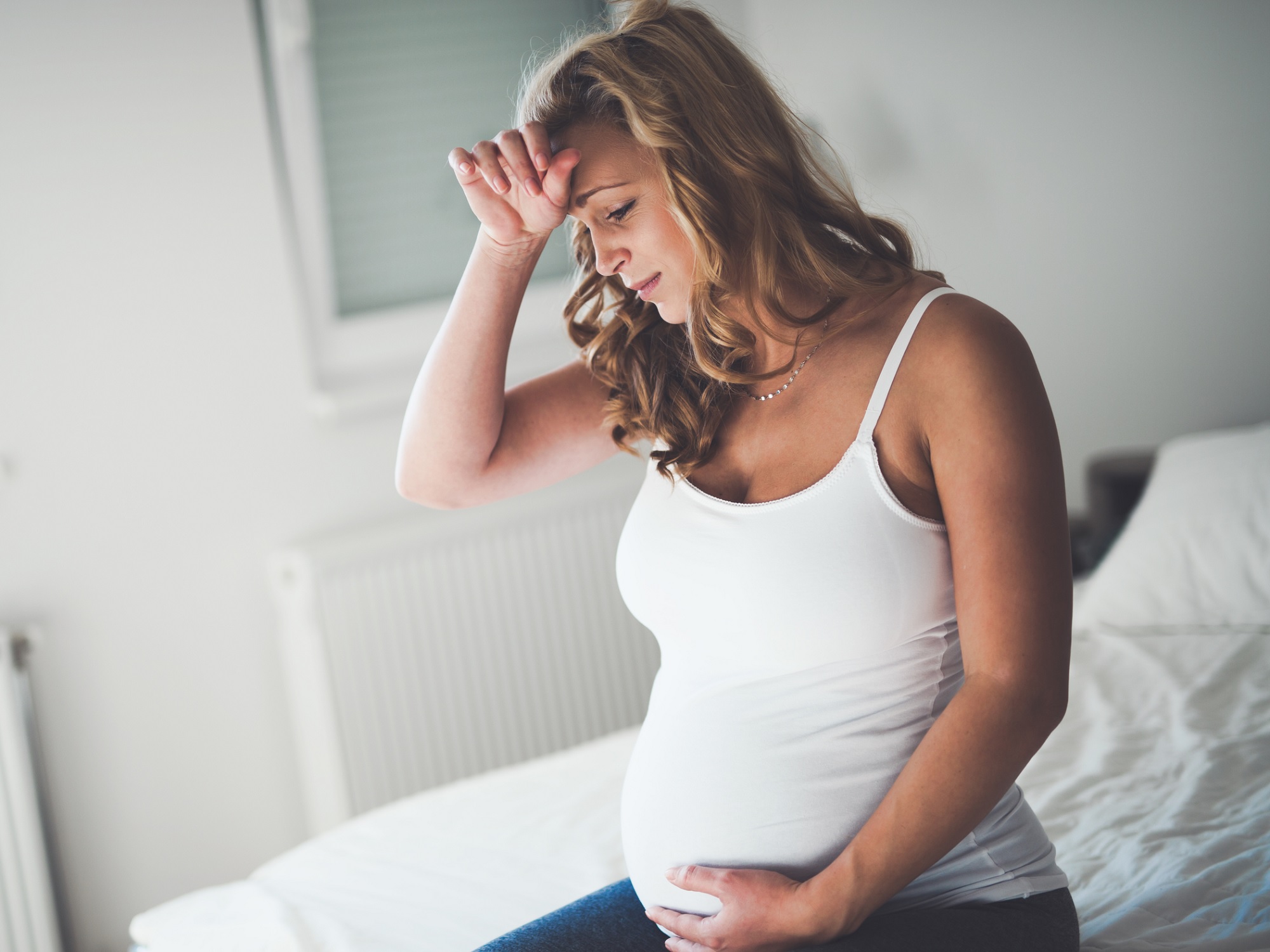 Pregnant woman looking stressed