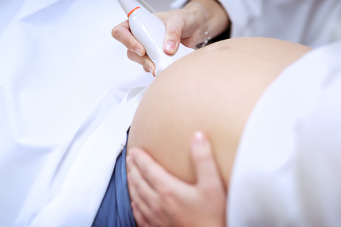 woman in third trimester having ultrasound
