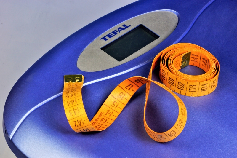 scales and tape measure signifying weight loss