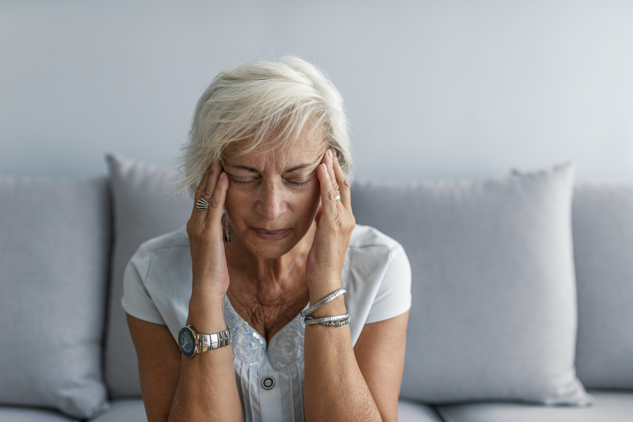 senior woman with migraine