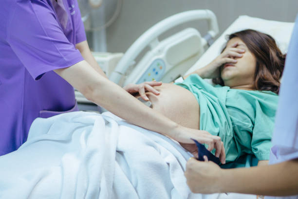 woman in labour with healthcare worker